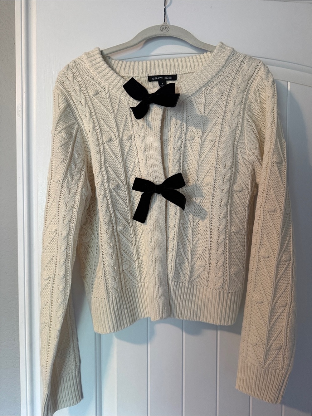41 Hawthorn Cream Cable-Knit Sweater with Black Bow Accents